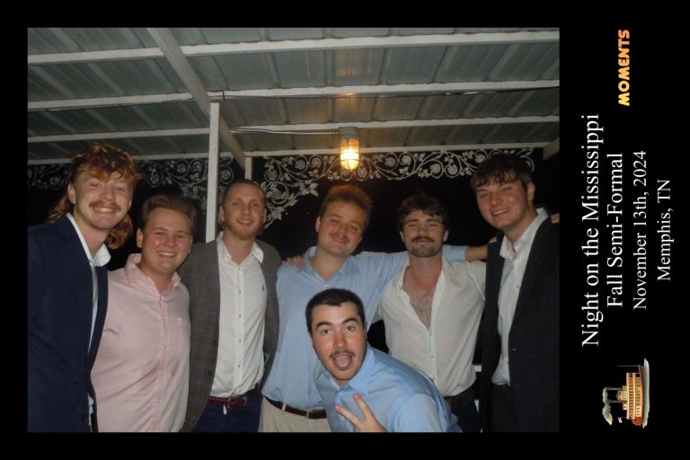 large group of fraternity men on a riverboat formal event with custom moments event border applied
