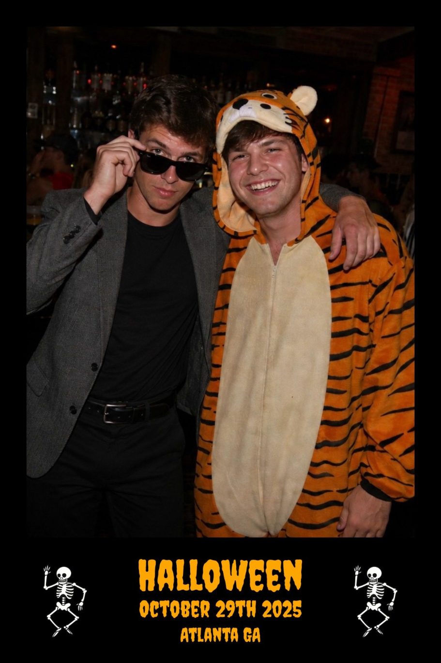 two fraternity men in costumes at a Halloween party, displayed using a custom moments Halloween border